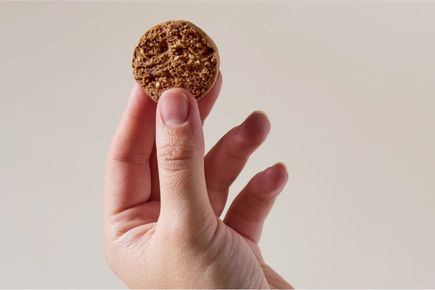 person holding a supplement